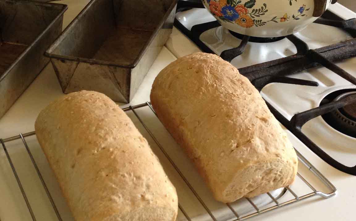 2 loaves Grains Bread showing baking pans