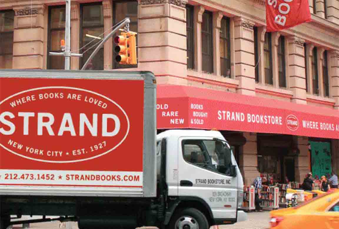 The Strand Bookstore ad image of a truck with Strand ad moving past the NYC store