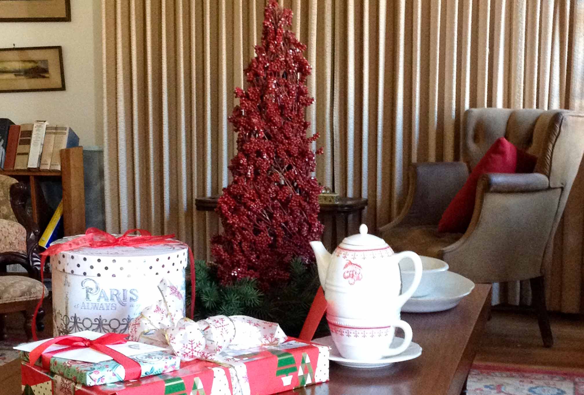 red Christmas tree on coffee table in living room