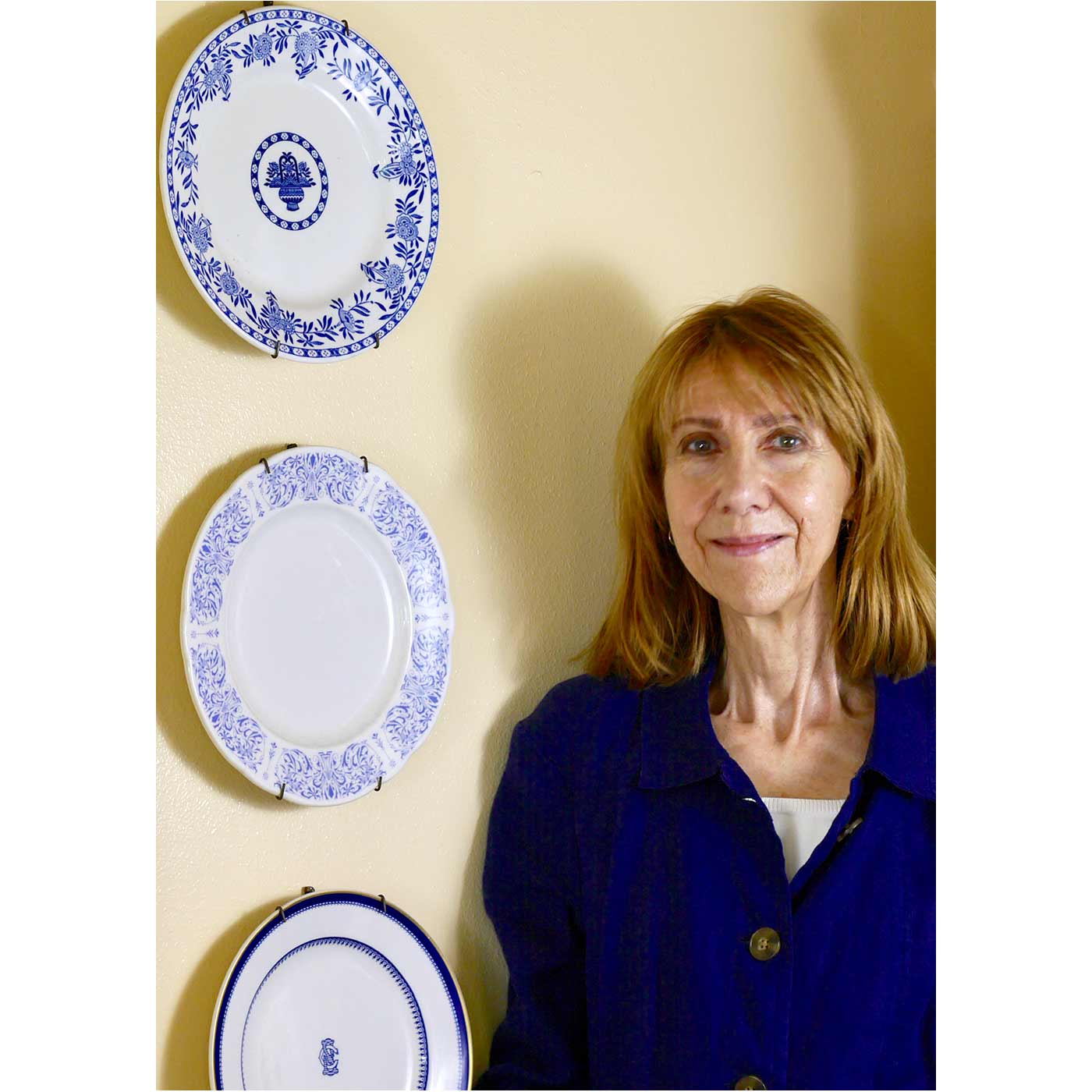 Anne and three of her blue and white plates