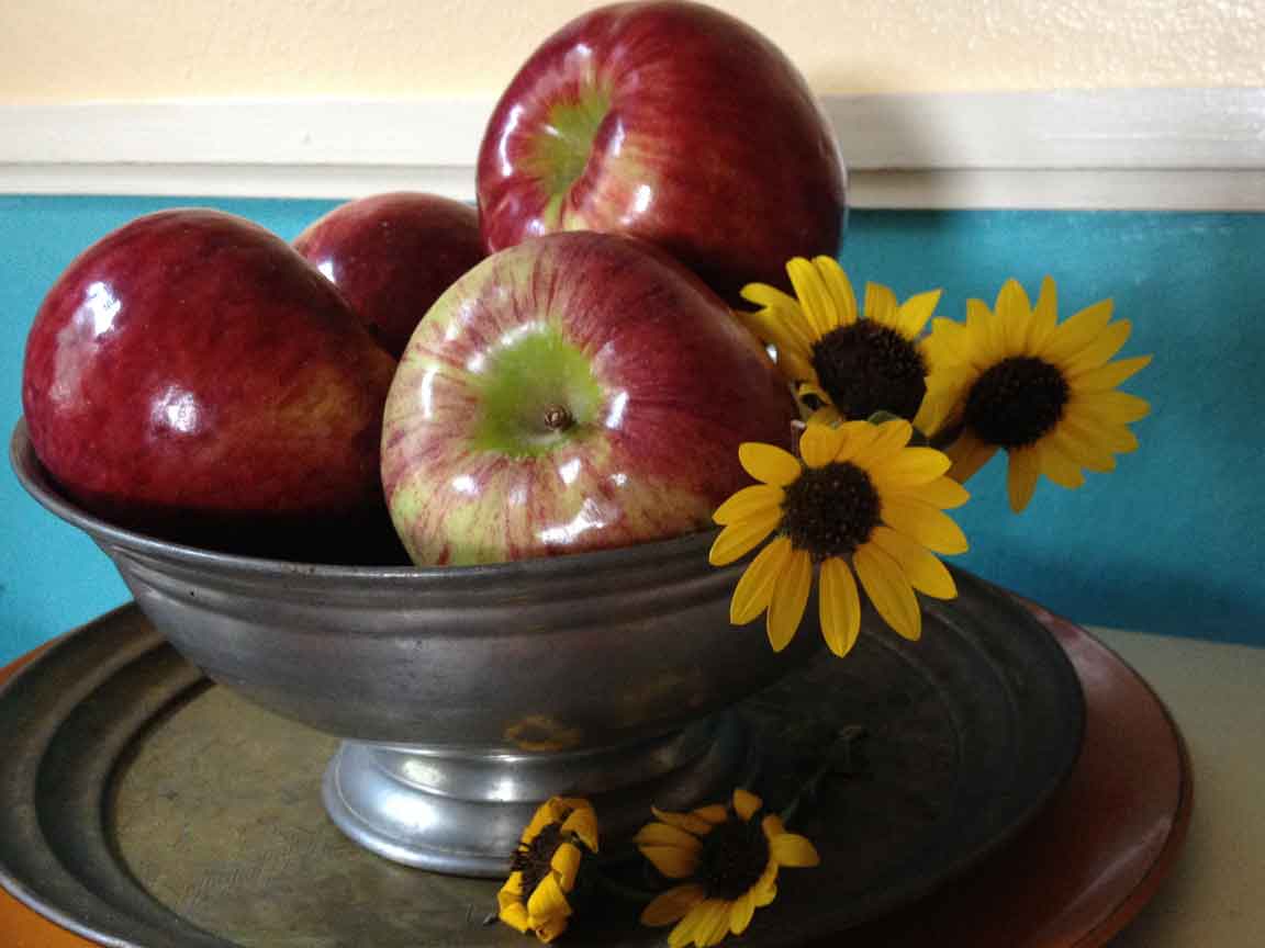 cortland apples with sunflowers in pewter bowl