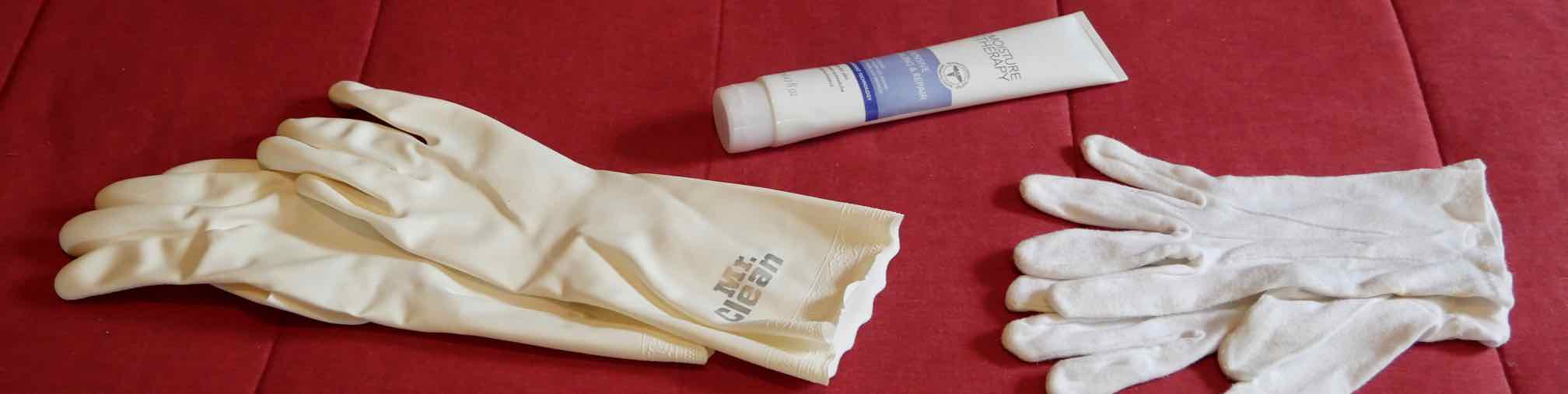  protective latex gloves, tube of hand cream, and white cotton gloves