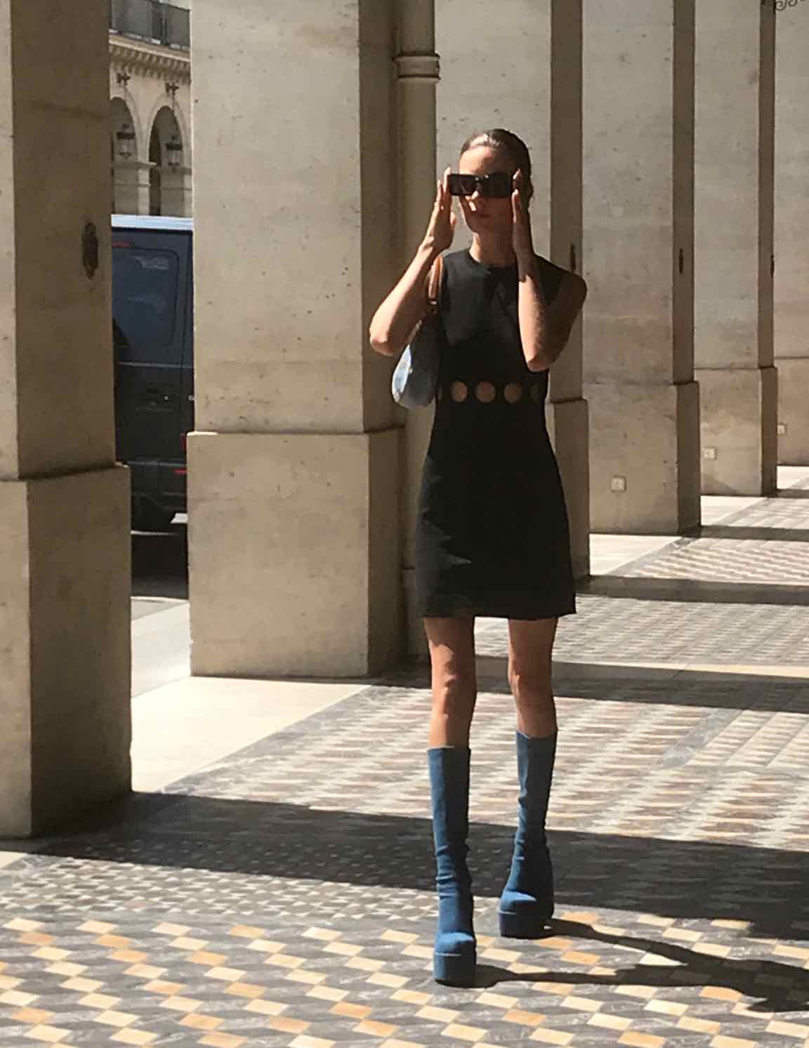 woman in black dress, sunglasses and blue platform boots